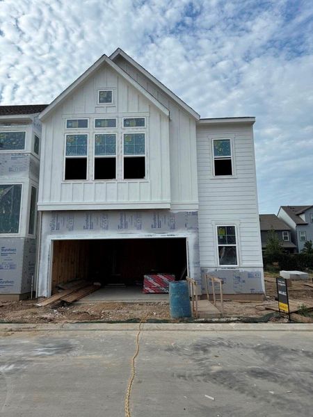 Front exterior of a new home in Retreat at Oak Park, Houston, TX, highlighting curb appeal (Image 12).