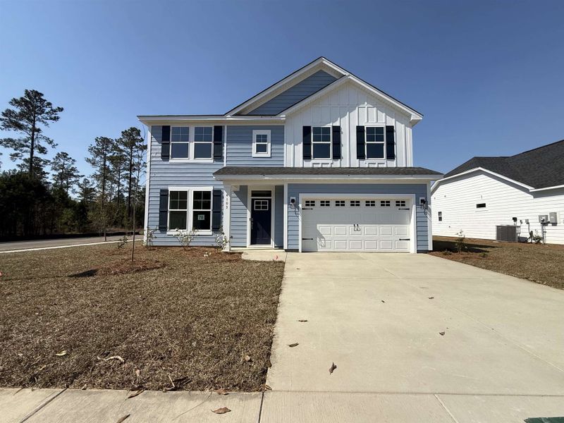 Front exterior of a new home in Westwood Reserve, Conway, SC, highlighting curb appeal (Image 2). Front exterior of a new home in Westwood Reserve, Conway, SC, highlighting curb appeal (Image 2).
