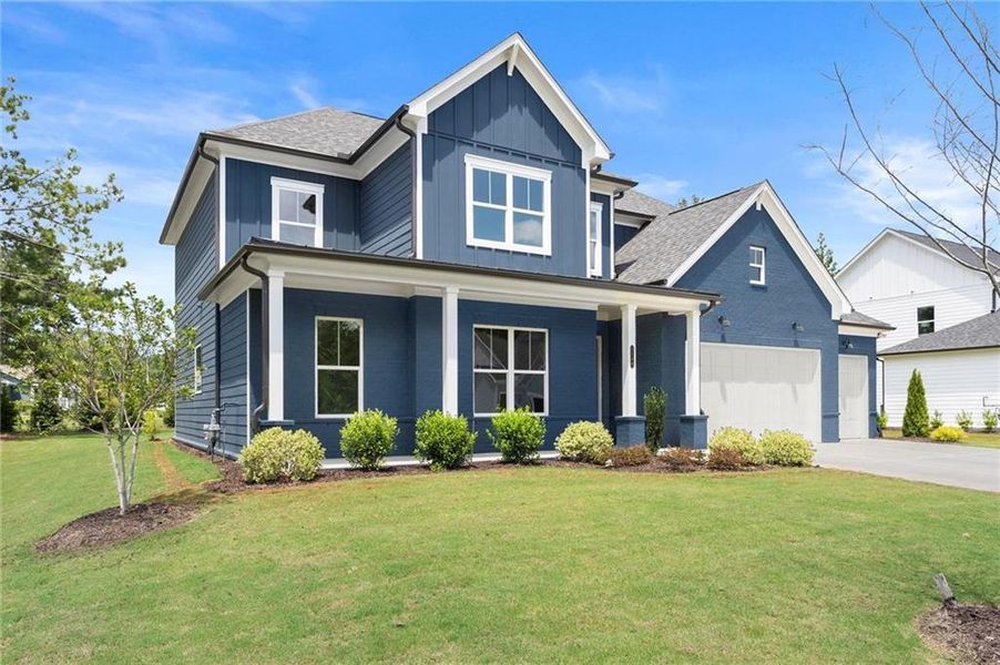 Front exterior of a new home in Hillgrove Preserve, Powder Springs, GA, highlighting curb appeal (Image 24).