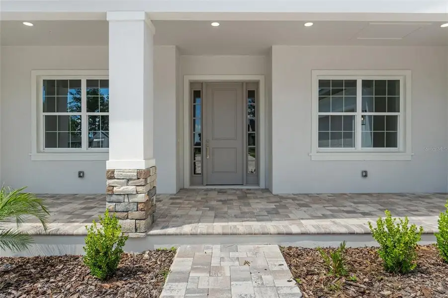 Front exterior of a new home in Southern Hills Plantation, Brooksville, FL, highlighting curb appeal (Image 2).