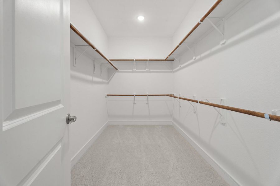 Primary walk-in closet (*Photo not of actual home and used for illustration purposes only.) Primary walk-in closet (*Photo not of actual home and used for illustration purposes only.)