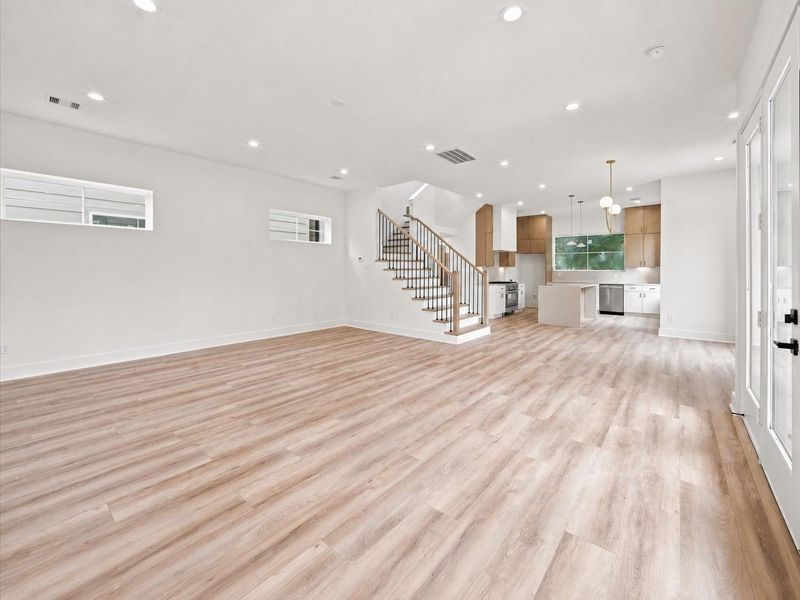 Spacious living with view of the recessed dining area and kitchen. Spacious living with view of the recessed dining area and kitchen.