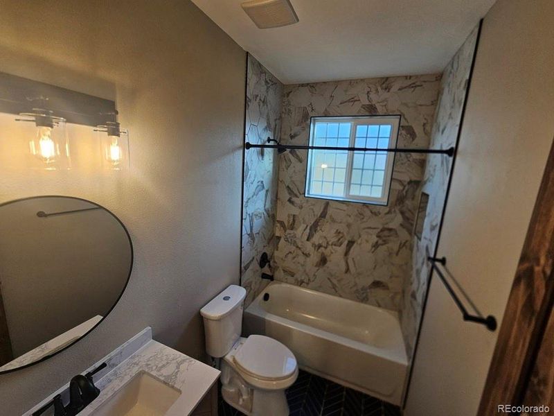 Full Secondary Bathroom at end of the Hall.