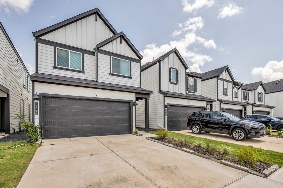 Front exterior of a new home in City Gate North, Houston, TX, highlighting curb appeal (Image 1). Front exterior of a new home in City Gate North, Houston, TX, highlighting curb appeal (Image 1).