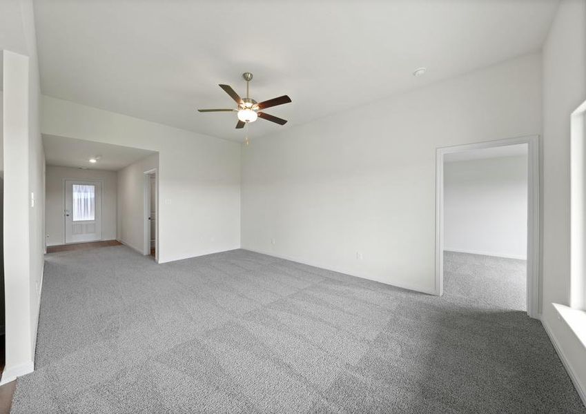 The spacious family room is perfect for family living and hosting.