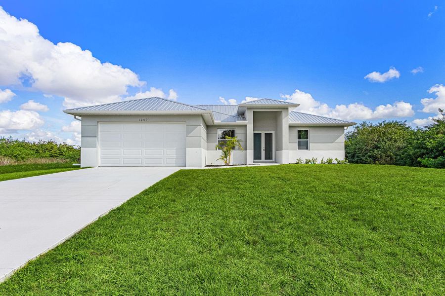 Front exterior of a new home in , Labelle, FL, highlighting curb appeal (Image 17).