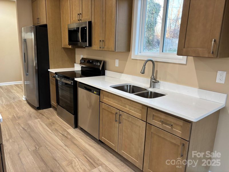 Custom cabinets and quartz counters. So bright and flows nicely! Custom cabinets and quartz counters. So bright and flows nicely!