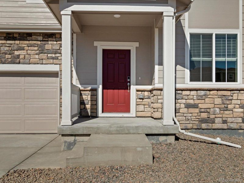Front exterior of a new home in Hidden Valley Farm, Severance, CO, highlighting curb appeal (Image 1). Front exterior of a new home in Hidden Valley Farm, Severance, CO, highlighting curb appeal (Image 1).