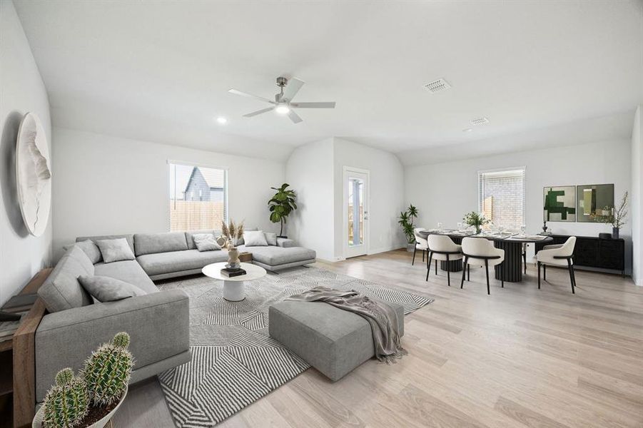 Dining and Living Room in the Harrison home plan by Trophy Signature Homes – REPRESENTATIVE PHOTO