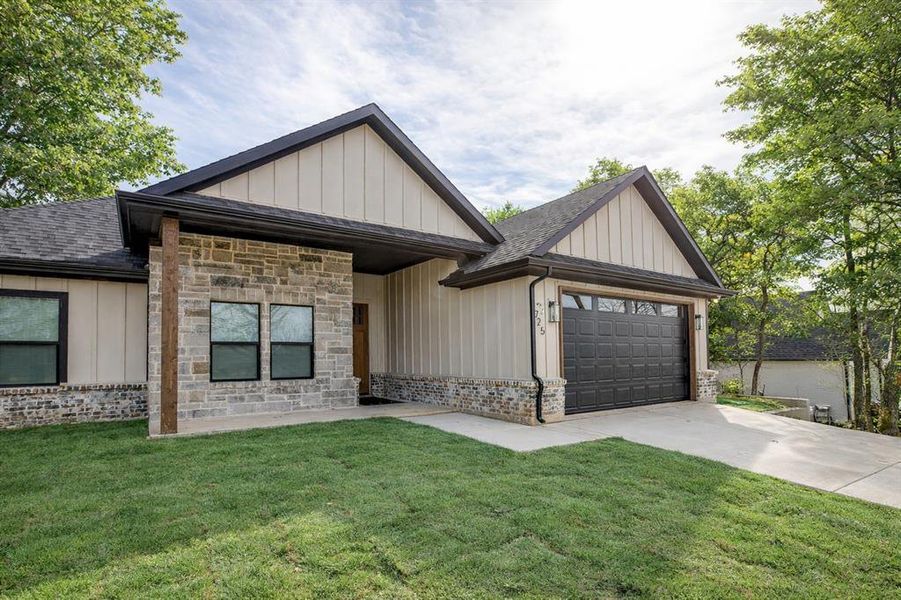 Front exterior of a new home in , Runaway Bay, TX, highlighting curb appeal (Image 27). Front exterior of a new home in , Runaway Bay, TX, highlighting curb appeal (Image 27).