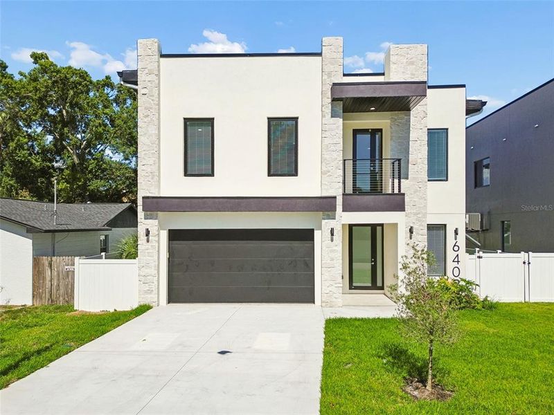 Front exterior of a new home in , Tampa, FL, highlighting curb appeal (Image 2). Front exterior of a new home in , Tampa, FL, highlighting curb appeal (Image 2).