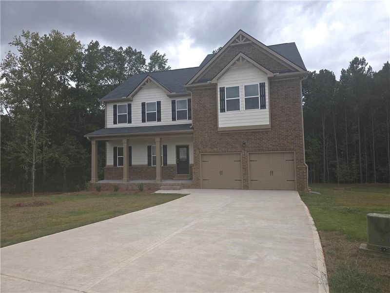 Front exterior of a new home in Southern Hills, McDonough, GA, highlighting curb appeal (Image 24).