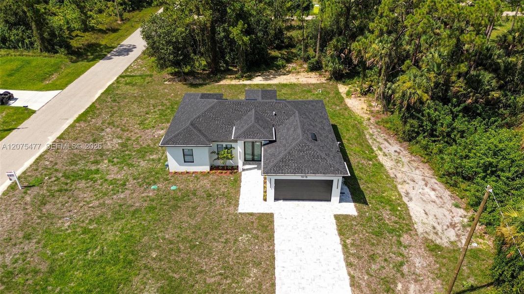 Front exterior of a new home in , Lehigh Acres, FL, highlighting curb appeal (Image 35). Front exterior of a new home in , Lehigh Acres, FL, highlighting curb appeal (Image 35).