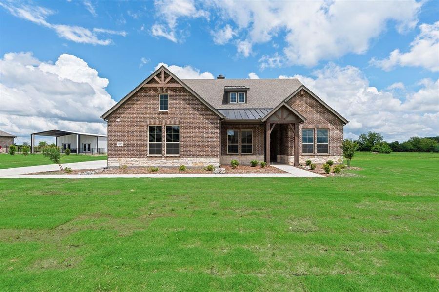 Front exterior of a new home in Fannin Ranch, Leonard, TX, highlighting curb appeal (Image 22). Front exterior of a new home in Fannin Ranch, Leonard, TX, highlighting curb appeal (Image 22).