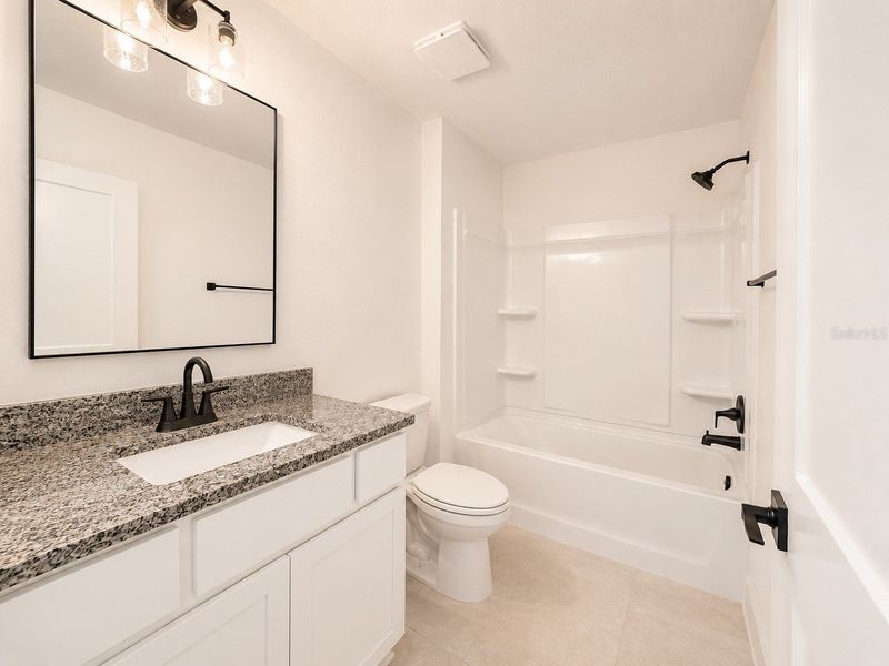 Furnished interior view inside a new home in Harmony Central, St. Cloud (Image 8).