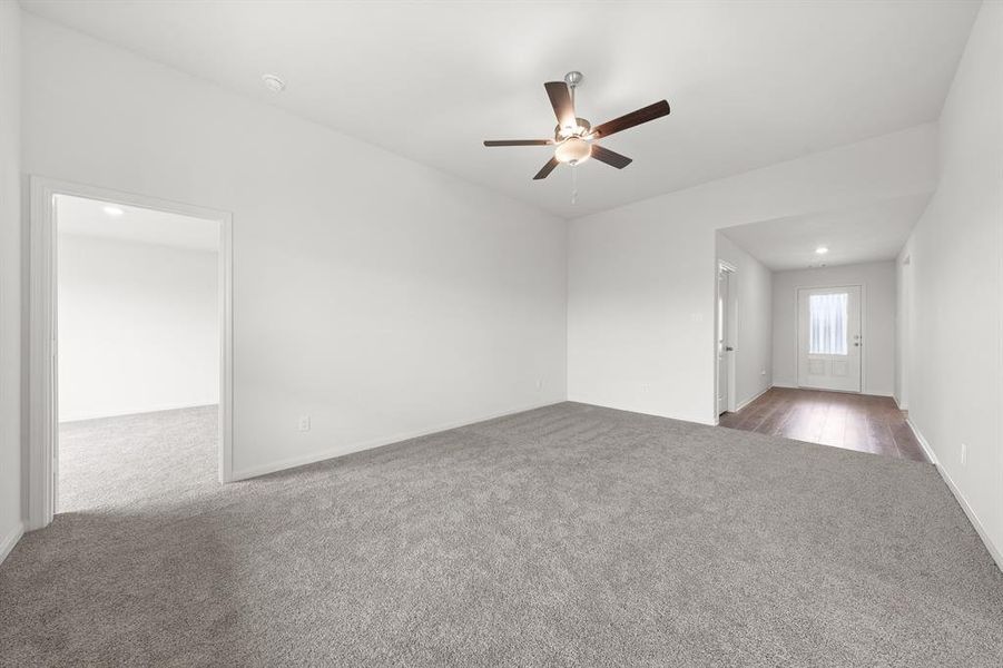 Unfurnished room featuring hardwood / wood-style floors and ceiling fan