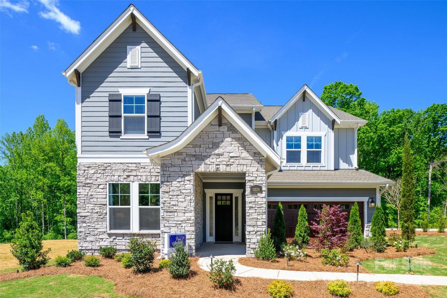 Front exterior of a new home in North Creek Village, Huntersville, NC, highlighting curb appeal (Image 2).