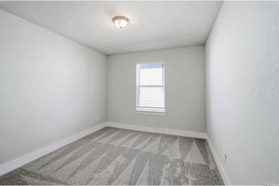 Spacious, unfurnished interior of a new home in The Woodlands at Medina Hills, Mico (Image 23).