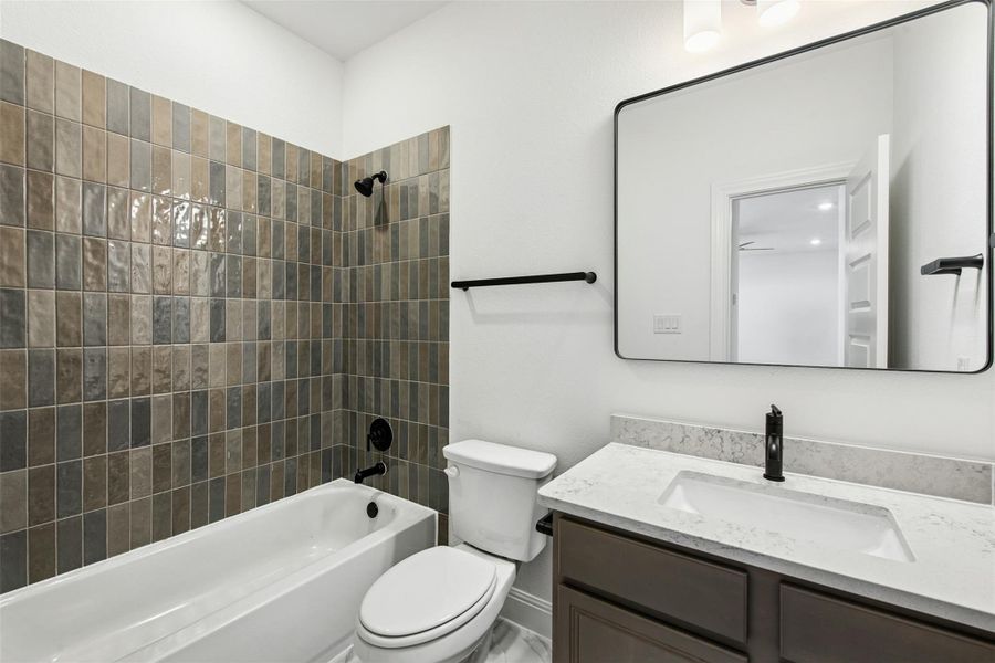 Bathroom featuring vanity and tub / shower combination
