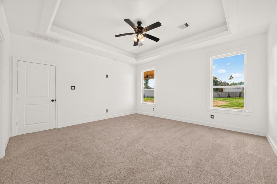 Oversized primary bedroom provides an abundance of space