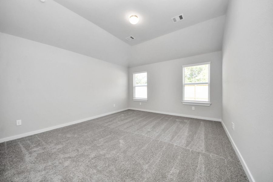 Another perspective unveils a comprehensive view of the serenity and comfort this primary suite offers. Sample photo of completed home with similar floor plan. Actual colors and selections may vary. Another perspective unveils a comprehensive view of the serenity and comfort this primary suite offers. Sample photo of completed home with similar floor plan. Actual colors and selections may vary.