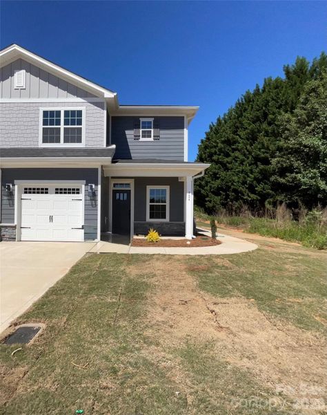 Exterior details and patio area of a home in Pine Trace, Gastonia (Image 14).