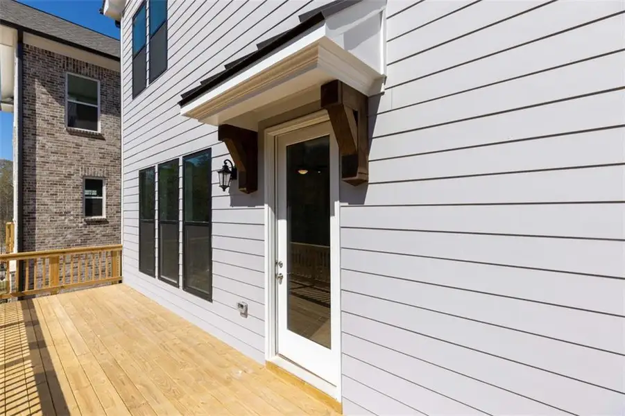 Exterior details and patio area of a home in Brackley Single Family, Cumming (Image 4).