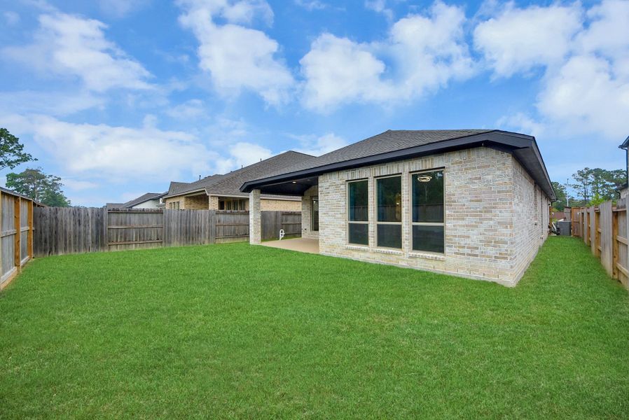 Exterior details and patio area of a home in , Humble (Image 31).