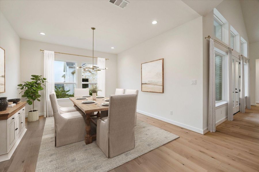 Dining Area, found off the Kitchen and Living. View looking out to the Backyard. This photo has been virtually staged.