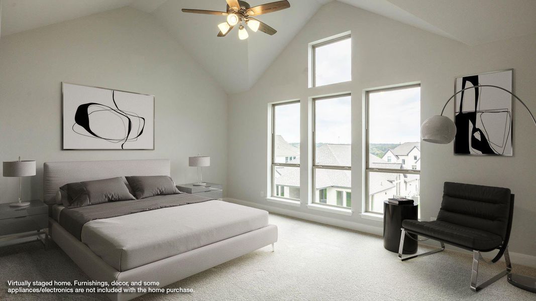 Carpeted bedroom featuring high vaulted ceiling and ceiling fan