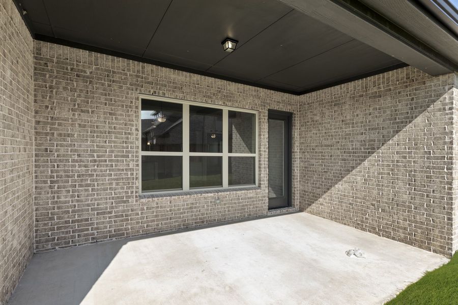 Exterior details and patio area of a home in River Ranch, Van Alstyne (Image 3).