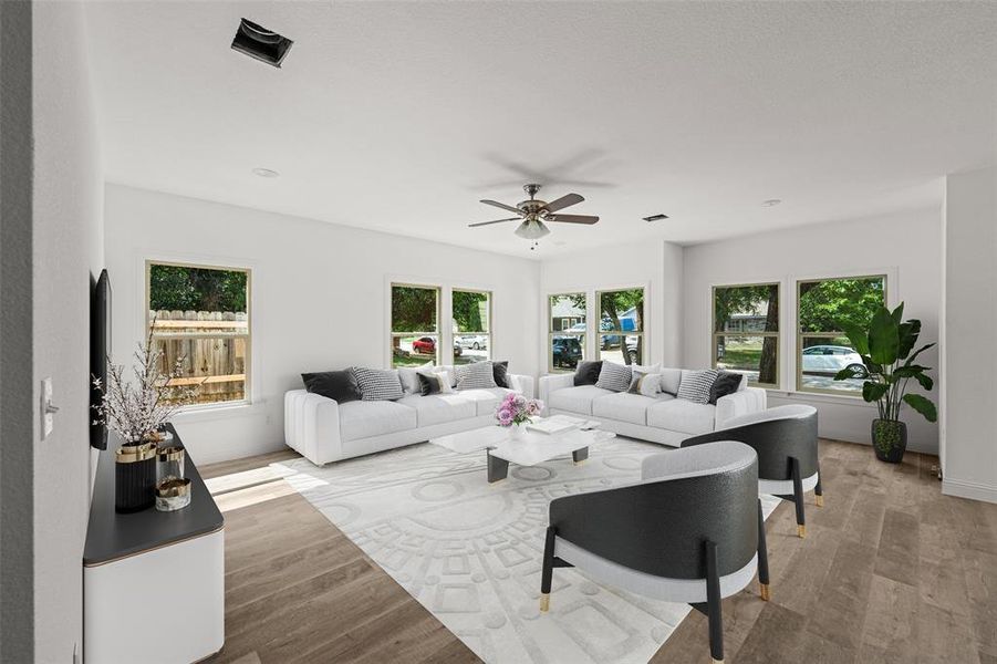 Living room featuring light wood-type flooring and ceiling fan