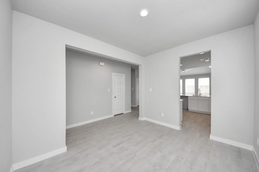 Make memories gathered around the table with your family and friends! This spacious dining room features elegant flooring, custom paint, and adjacent to family room and kitchen for open concept feel. Sample photo of completed home with similar floor plan. Actual colors and selections may vary. Make memories gathered around the table with your family and friends! This spacious dining room features elegant flooring, custom paint, and adjacent to family room and kitchen for open concept feel. Sample photo of completed home with similar floor plan. Actual colors and selections may vary.