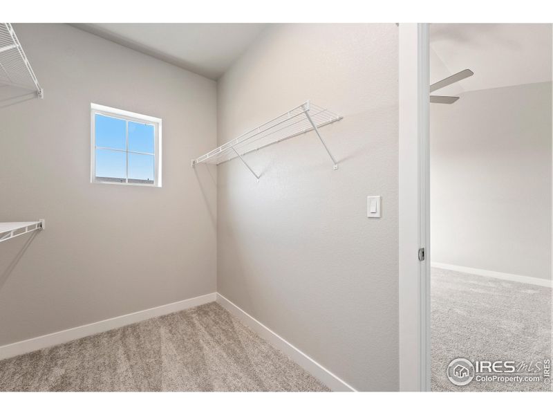 Primary closet with built in shelves