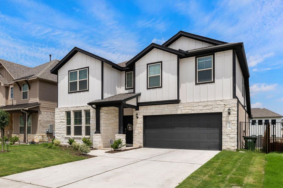 Front exterior of a new home in Saddleback at Santa Rita Ranch, Liberty Hill, TX, highlighting curb appeal (Image 20).