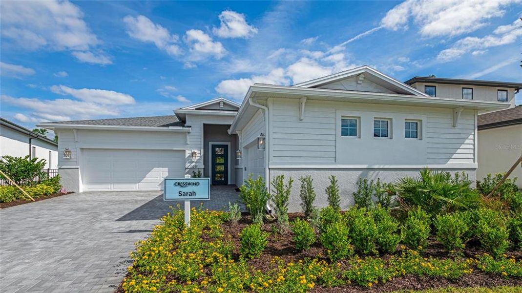 Front exterior of a new home in Cresswind DeLand, Deland, FL, highlighting curb appeal (Image 2). Front exterior of a new home in Cresswind DeLand, Deland, FL, highlighting curb appeal (Image 2).