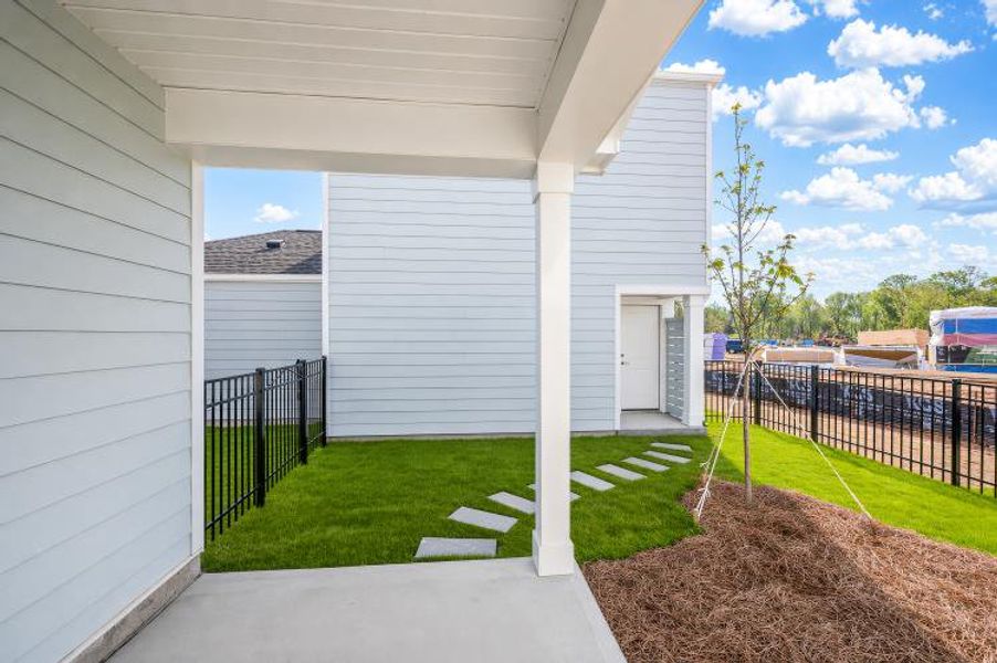 Exterior details and patio area of a home in North Creek Village - Townhomes, Huntersville (Image 4). Exterior details and patio area of a home in North Creek Village - Townhomes, Huntersville (Image 4).