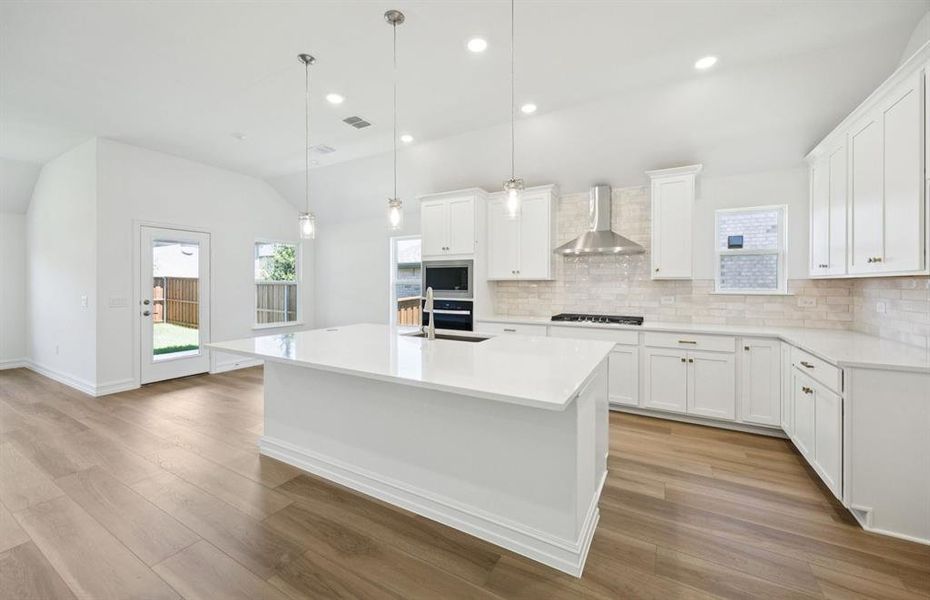 Bright kitchen with oversized island *real home pictured Bright kitchen with oversized island *real home pictured