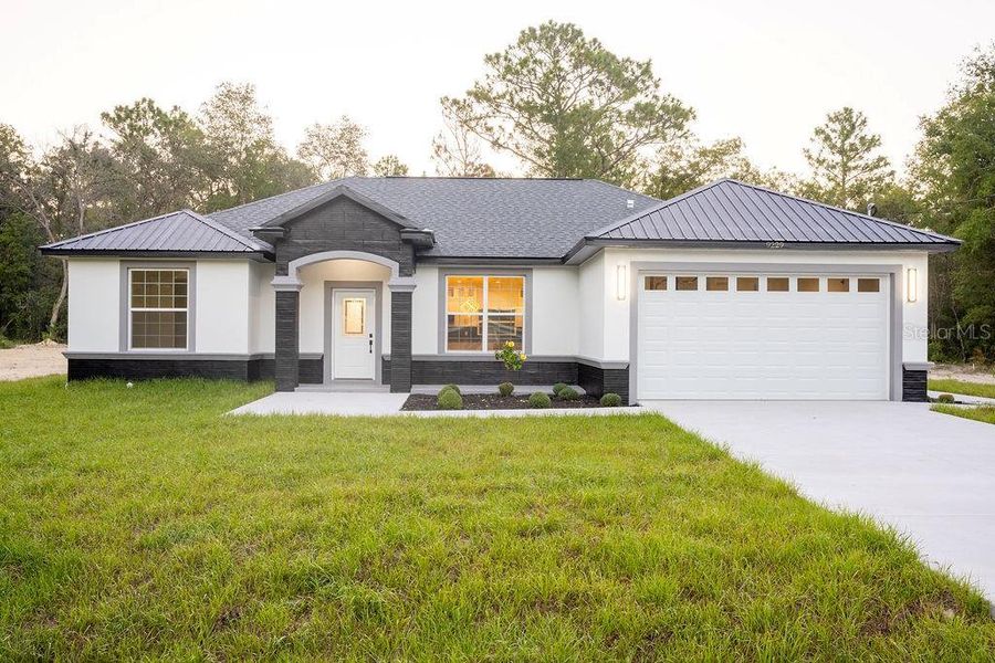 Front exterior of a new home in , Dunnellon, FL, highlighting curb appeal (Image 25). Front exterior of a new home in , Dunnellon, FL, highlighting curb appeal (Image 25).