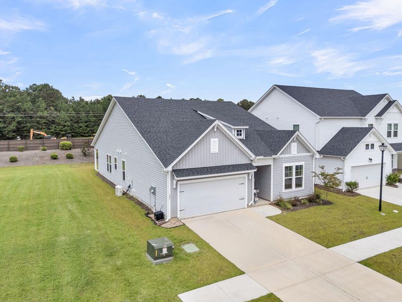 Front exterior of a new home in The Groves of Berkeley, Moncks Corner, SC, highlighting curb appeal (Image 22).