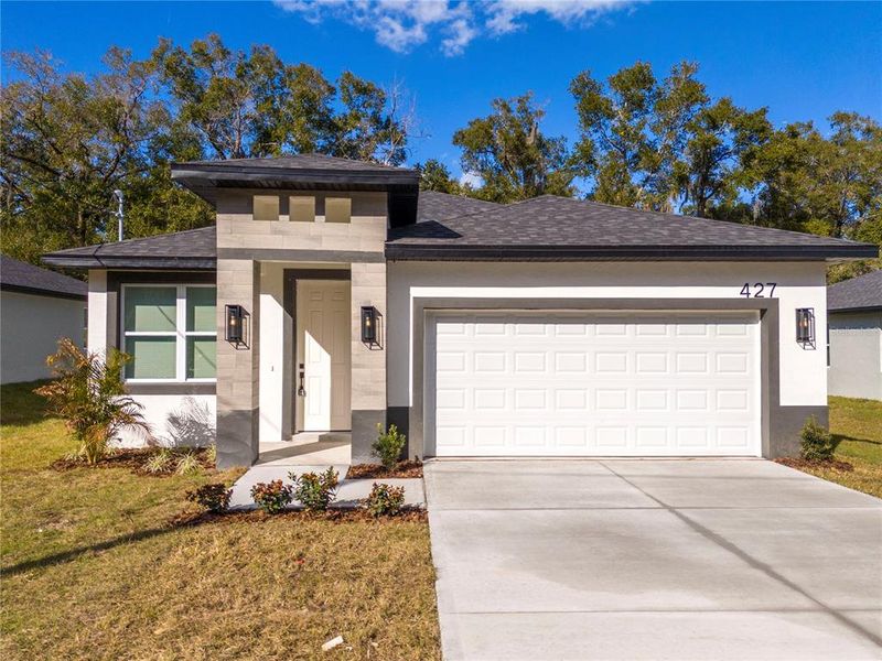 Front exterior of a new home in , Apopka, FL, highlighting curb appeal (Image 1). Front exterior of a new home in , Apopka, FL, highlighting curb appeal (Image 1).