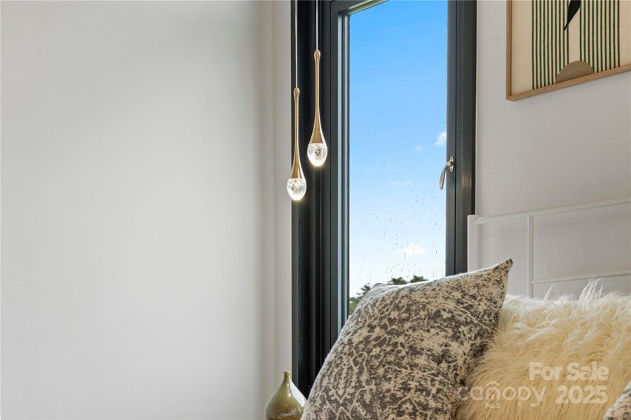 Primary bedroom features designer pendant bedside lights Primary bedroom features designer pendant bedside lights