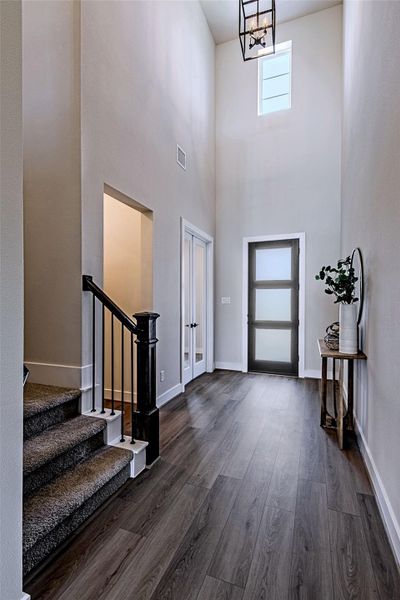 Another view of the spacious entry hallway and staircase