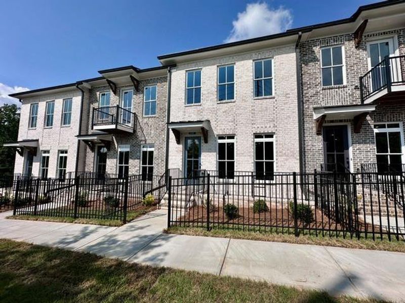 Exterior details and patio area of a home in Ward's Crossing Townhomes, Johns Creek (Image 23).