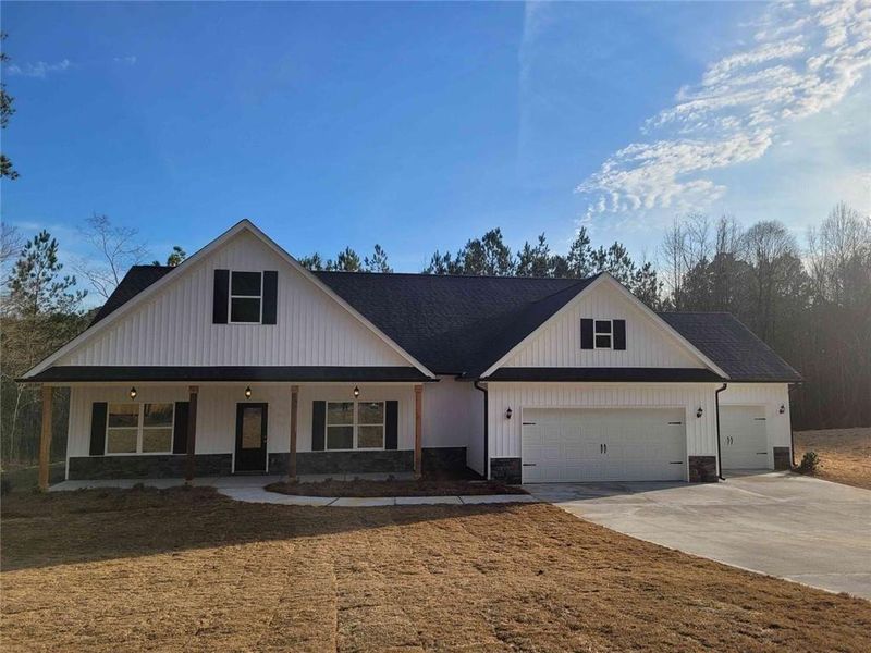 Front exterior of a new home in , Dallas, GA, highlighting curb appeal (Image 20).