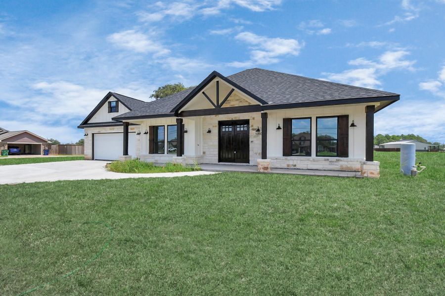 Front exterior of a new home in , Angleton, TX, highlighting curb appeal (Image 26).