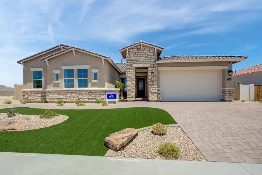 Front exterior of a new home in Canyon Views – 80’ Paradise Series, Litchfield Park, AZ, highlighting curb appeal (Image 1). Front exterior of a new home in Canyon Views – 80’ Paradise Series, Litchfield Park, AZ, highlighting curb appeal (Image 1).