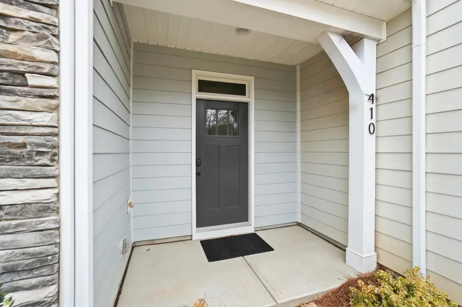 Exterior details and patio area of a home in Blythe Mill Townhomes, Waxhaw (Image 3).