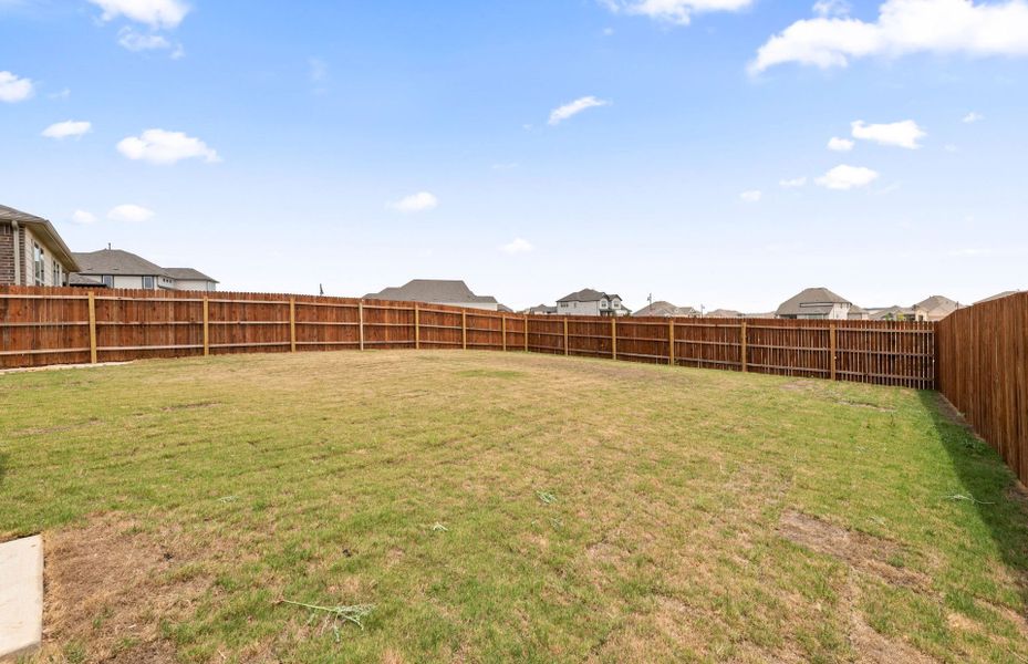 Exterior details and patio area of a home in Saddleback at Santa Rita Ranch, Liberty Hill (Image 25).