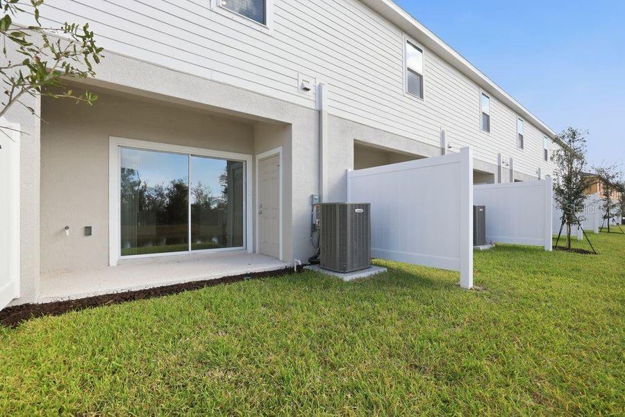 Exterior details and patio area of a home in The Towns at Firethorn, Parrish (Image 3).